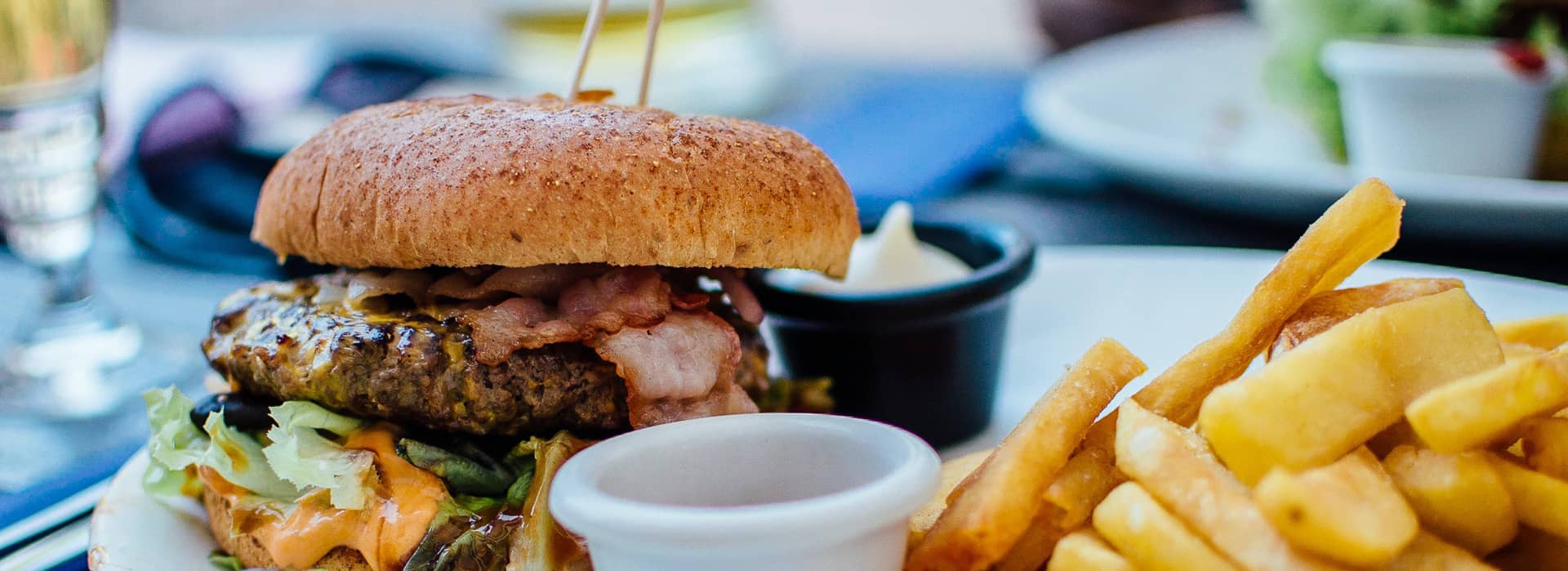 A photo of a gourmet pub burger and fries