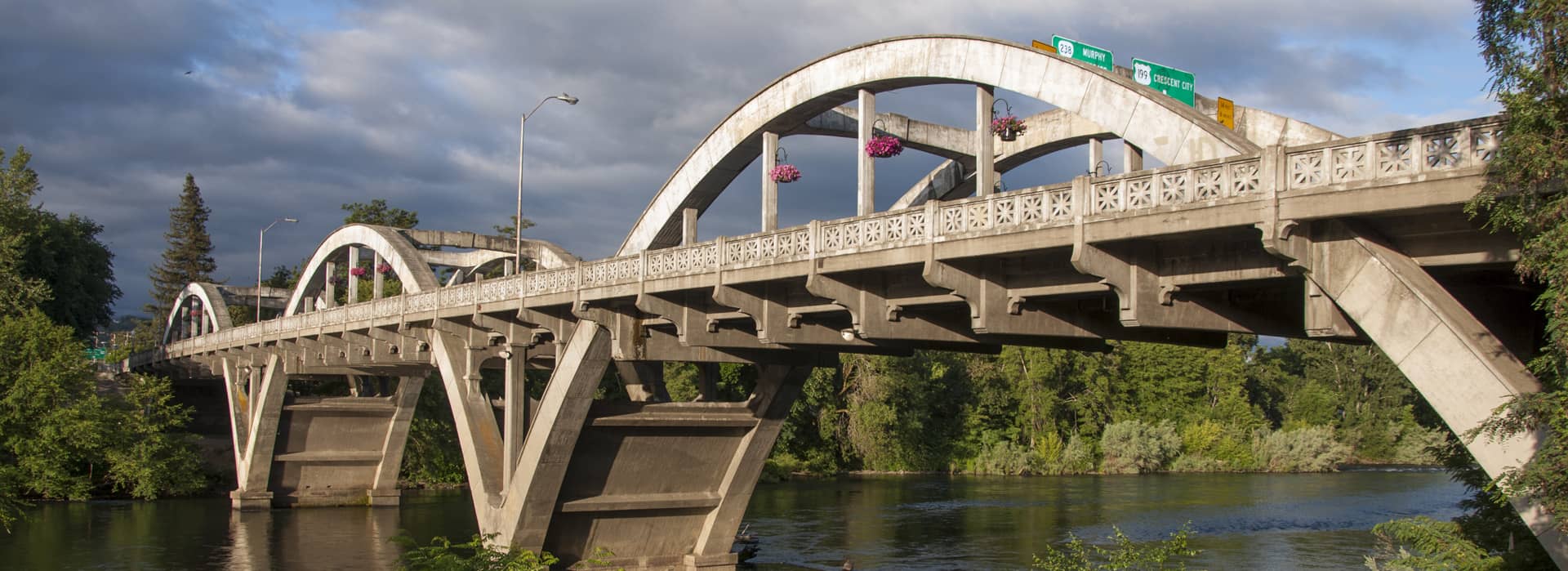 a photo of an old bridge over the river in Grants pass oregon