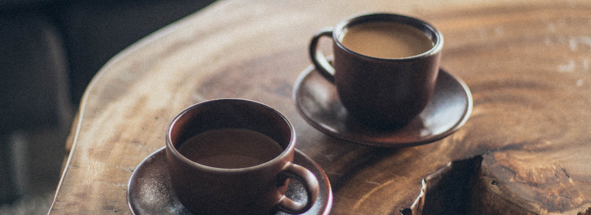 coffee cups sitting on live edge wood table
